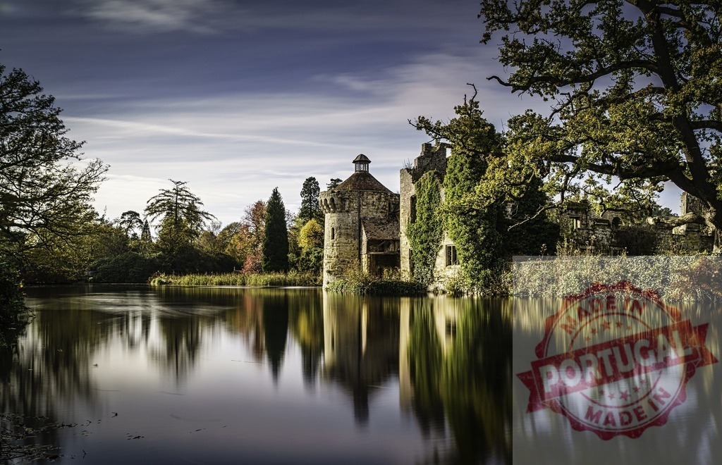 Scotney Castle reflecting in waters of moated lake | Scotney Castle with its old stone structure and abundant ivy reflecting in the calm lake - Realized with Pictrs.com