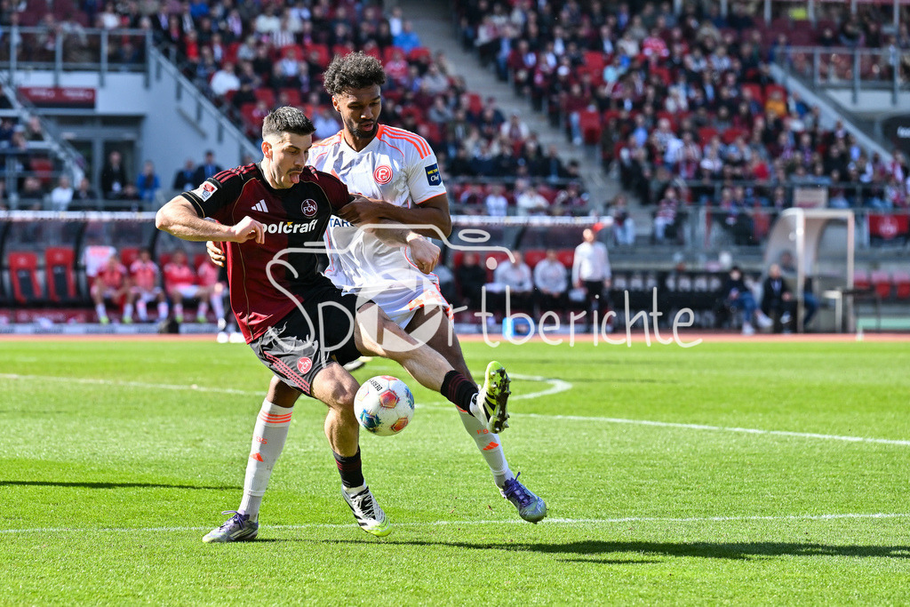 1. FC Nürnberg - Fortuna Düsseldorf | NUREMBERG, GERMANY - 07. MARCH:  im Duell Elias EGOULI (Fortuna Düsseldorf 44) und Luka LOCHOSHVILI (1. FC Nuernberg 24) während dem Match zwischen dem 1. FC Nürnberg und Fortuna Düsseldorf am 25. Spieltag der 2. Bundesliga im Max Morlock Stadion / DFL REGULATIONS PROHIBIT ANY USE OF PHOTOGRAPHS AS IMAGE SEQUENCES AND/OR QUASI-VIDEO