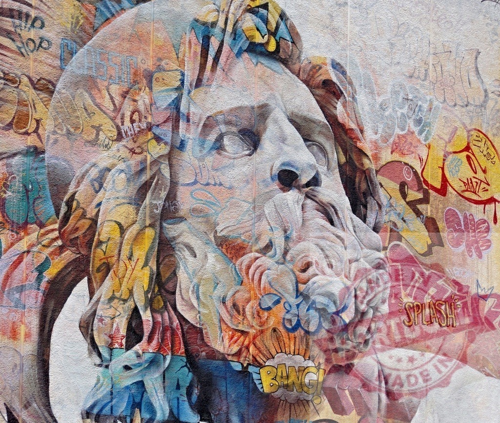 Colorful graffiti covering classical sculpture merging ancient art and modern street art | Colorful graffiti covering a classical sculpture, blending ancient art and modern street art in a striking juxtaposition - Realized with Pictrs.com
