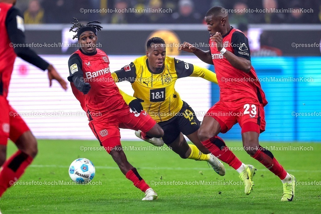 BVB10012502300 | 10.01.2025, Fußball, Borussia Dortmund - Bayer 04 Leverkusen, 1. Fußball Bundesliga, 16. Spieltag, Signal Iduna Park, Saison 2024 2025: Jeremie Frimpong (Bayer04 Leverkusen #30) und Nordi Mukiele (Bayer04 Leverkusen #23) im Zweikampf gegen Jamie Gittens (BVB #43)DFB regulations prohibit any use of photographs as image sequences and or quasi-video.