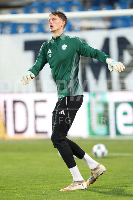 TSV Egger Glas Hartberg vs SV Oberbank Ried – Austrian Bundesliga Match | TSV Egger Glas Hartberg and SV Oberbank Ried. High-intensity match action, tackles, shots on goal, celebrations, fan atmosphere and stadium scenes captured in professional quality. The image shows Tom Ritzy Huelsmann (Hartberg).