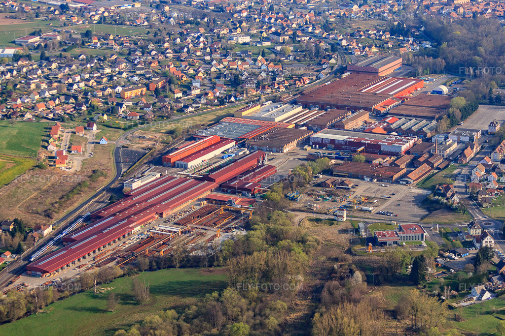 Aerial view: CAF Reichshoffen and Vossloh Switch Systems FRANCE - Reichshoffen in Reichshoffen in the state Bas-Rhin, France. – Photo: IMG_63741.jpg taken on 03/30/2014 by Werner Riehm/FLY-FOTO.com – Resolution of the original: 4752 x 3168 px – CAF | Construcciones y Auxiliar de Ferrocarriles\n – Vossloh