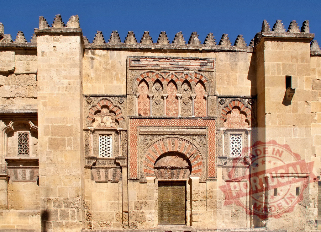 Mezquita de Córdoba Islamic architecture facade detail in Spain. Spain - Cordoba | Ornate gate and wall details from the historical Mosque-Cathedral of Córdoba - Realized with Pictrs.com