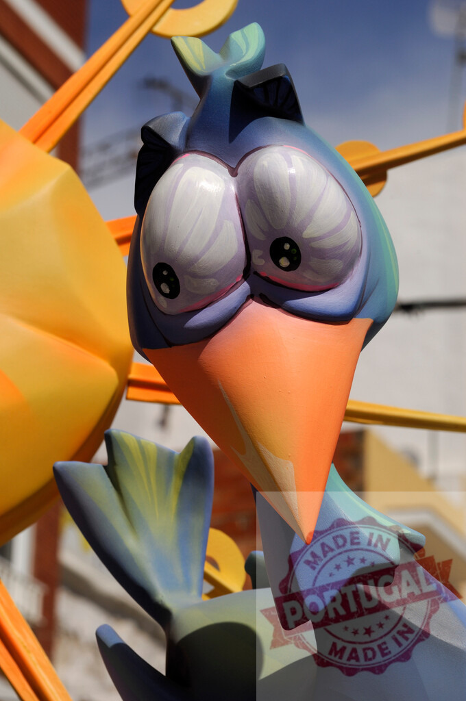 Colorful ninot cartoon bird at Las Fallas Valencia | Close up view of a colorful ninot cartoon bird from Las Fallas festival in Valencia - Realisiert mit Pictrs.com