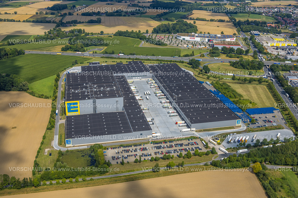 Hamm250701928Rhynern | Luftbild, Edeka Zentrallager, hinten Möbel Höffner Einrichtungshaus und Parkplatz, getrennt von der Autobahn A2 und Anschlussstelle Hamm, Stadtbezirk Rhynern, Hamm, Ruhrgebiet, Nordrhein-Westfalen, Deutschland