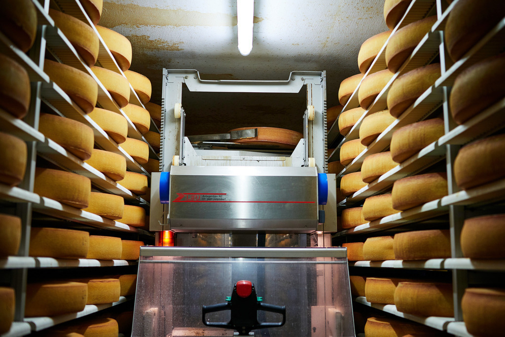 Sennerei Hittisau | Hittisau, Austria - July 29, 2019: Sennerei Hittisau; ein Blick in das Käselager mit einem Käse-Pflege-Roboter. - Realisiert mit Pictrs.com