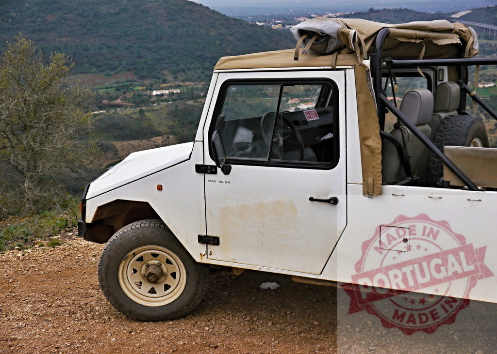 UMM Alter II off-road vehicle driving mountain dirt road | White UMM Alter II 4x4 off-road vehicle parked on a mountain dirt road, exploring nature - Realized with Pictrs.com