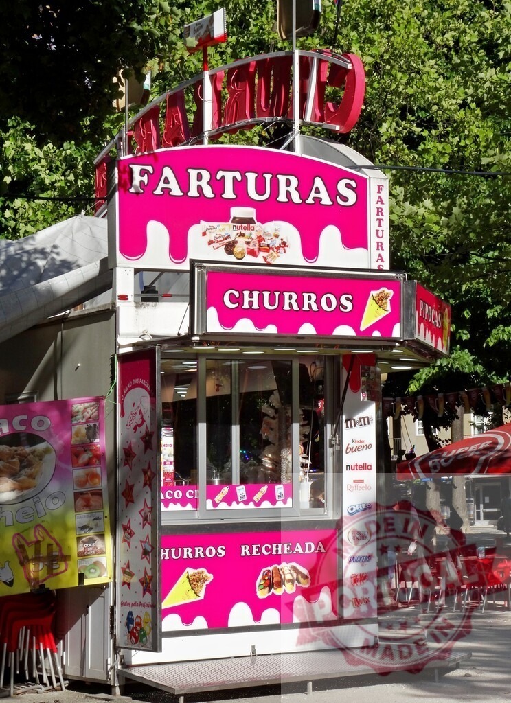 Pink food stall selling farturas, churros, and sweets outdoors | Food vendor selling sweet treats like farturas and churros from a vibrant pink stall - Realized with Pictrs.com