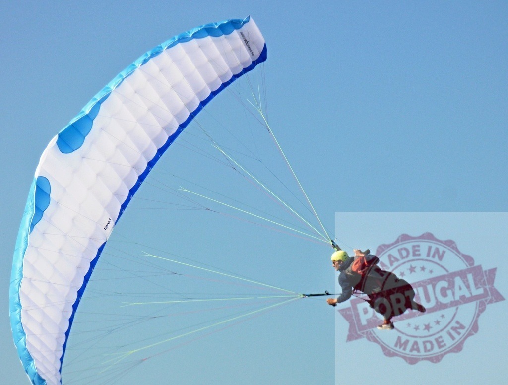 Paraglider flying in blue sky enjoying extreme sport | Paraglider navigating parachute wing against a clear blue sky, enjoying the freedom of flight - Realisiert mit Pictrs.com