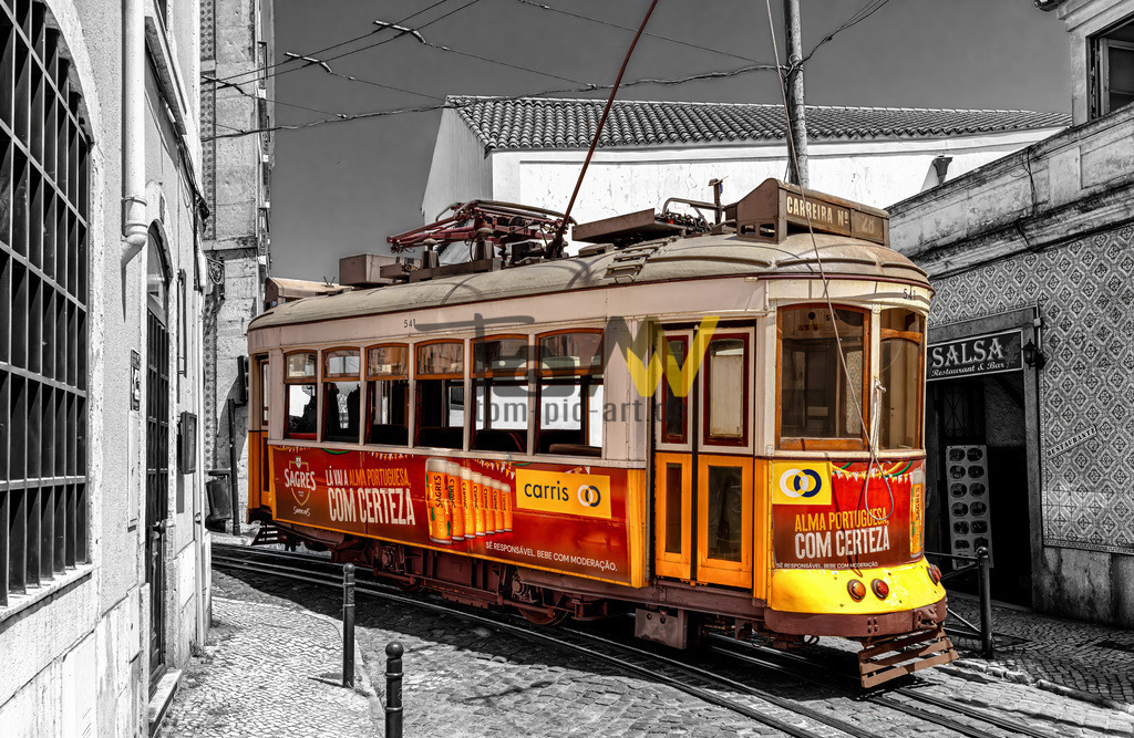 Die Straßenbahn der Linie 28E in Lissabon---Colorkey Look | Das Bild zeigt eine der ikonischen gelben Straßenbahnen von Lissabon. Die abgebildeten historischen Fahrzeuge verkehren hauptsächlich auf der berühmten Linie 28E. Diese Linie ist bei Touristen sehr beliebt, da sie durch viele malerische und historische Viertel der Stadt führt. - Realisiert mit Pictrs.com