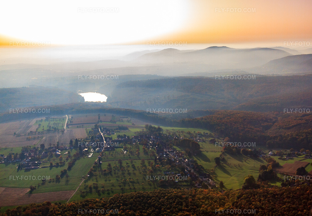 Aerial view: Village view in front of the lake on the Schwarzbach stream in Reichshoffen in the state Bas-Rhin, France. – Photo: IMG_54107.jpg taken on 10/21/2012 by Werner Riehm/FLY-FOTO.com – Resolution of the original: 4584 x 3168 px