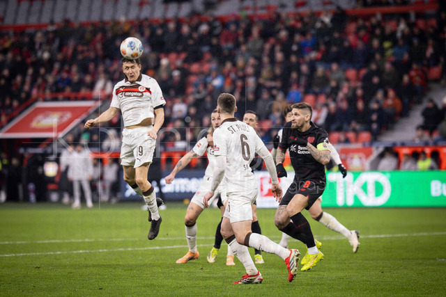 Bayer 04 Leverkusen vs. FC St. Pauli, 14.02.2026 | LEVERKUSEN, GERMANY - FEBRUARY 14: Abdoulie Ceesay (FC St. Pauli, 9) with a header  during the Bundesliga match (gameday 22)  between Bayer 04 Leverkusen vs. FC St. Pauli at BayArena on February 14, 2026 in Leverkusen, Germany. (Photo by Axel Kohring/Beautiful Sports Int.)DFL REGULATIONS PROHIBIT ANY USE OF PHOTOGRAPHS AS IMAGE SEQUENCES AND/OR QUASI-VIDEO.