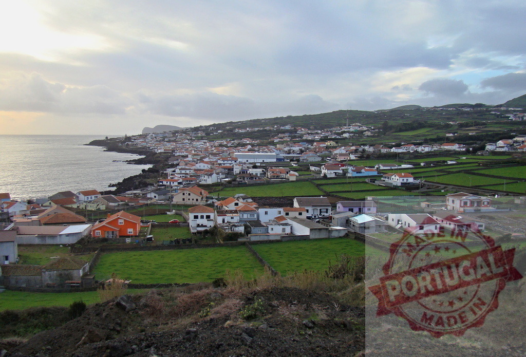 Coastal village São Miguel Island Azores landscape view | Coastal village on São Miguel Island, Azores, Portugal, featuring houses, fields, and ocean - Realized with Pictrs.com
