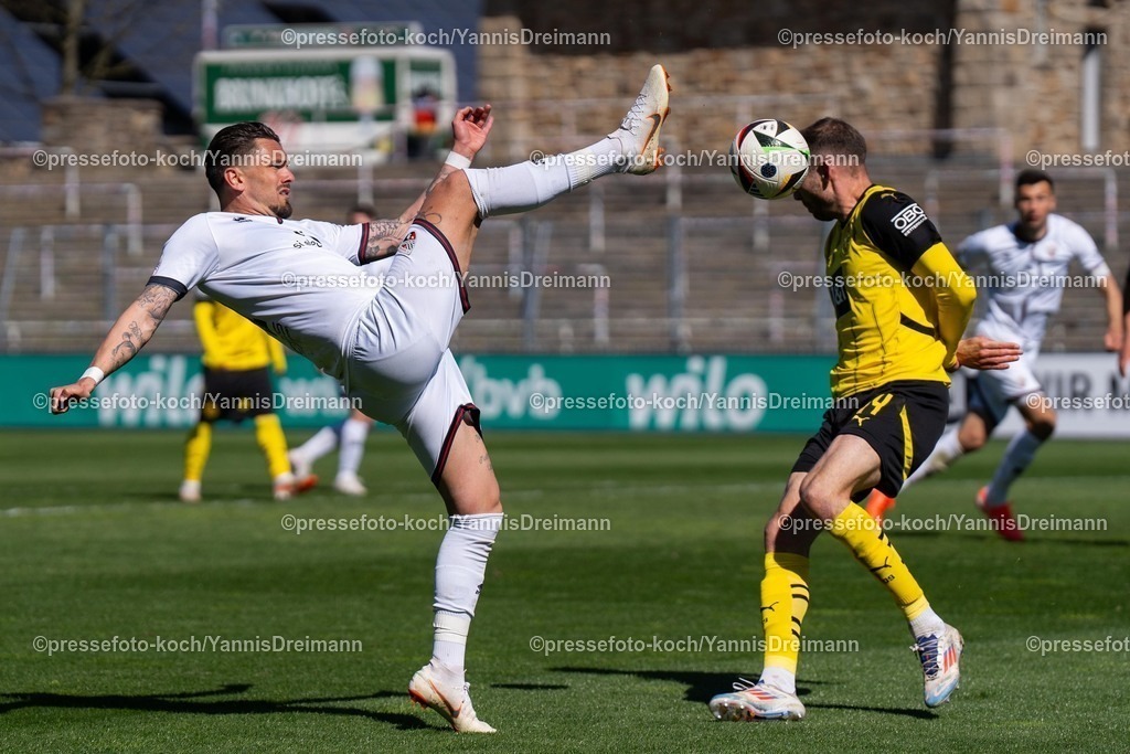 xydr06042501031 | 06.04.2025, xydrx, Fußball, Borussia Dortmund II - FC Ingolstadt 04, 3.Liga, Stadion Rote Erde, Saison 2024 2025: Pascal Testroet (FC Ingolstadt #37) im Zweikampf gegen Michael Eberwein (Borussia Dortmund II #14) DFB regulations prohibit any use of photographs as image sequences and or quasi-video.