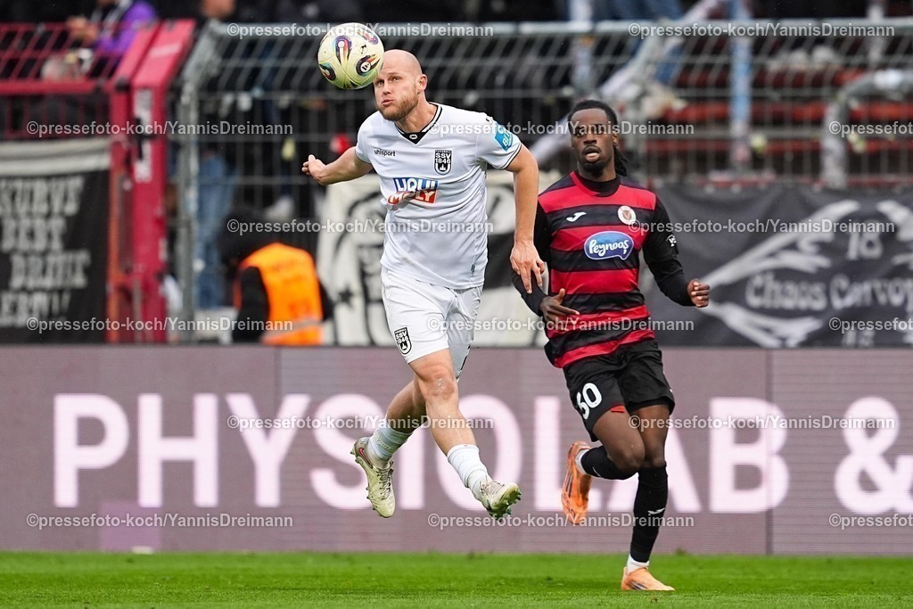 xYDRx06122501044 | 06.12.2025, xydrx, Fußball, 3.Liga, FC Viktoria Köln - SSV Ulm 1846, Saison 2025 2026, Sportpark Höhenberg: Marcel Seegert (SSV Ulm 1846 #21) Yannick Tonye (FC Viktoria Köln #30)       DFB regulations prohibit any use of photographs as image sequences and or quasi-video.Photo: xYannisxDreimannxPressefotoKochx