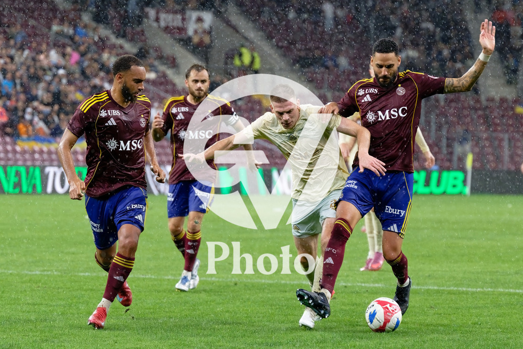 UEFA Conference League Play-offs 2nd leg - Servette FC v FC Shakhtar Donetsk | Dylan Bronn (25 Servette FC) Anthony Baron (6 Servette FC) and Artem Bondarenko (21 FC Shakhtar Donetsk) battle for the ball (duel)  during the UEFA Conference League Play-offs 2nd leg match between Servette FC and FC Shakhtar Donetsk at Stade de Geneve in Geneva, Switzerland