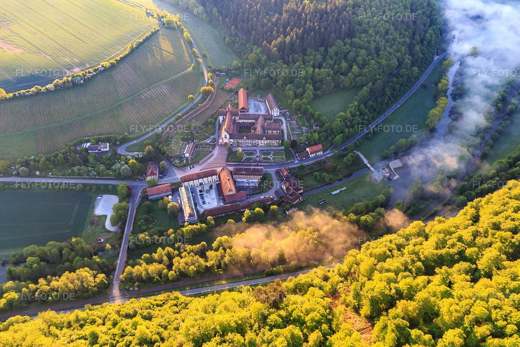 Hotel Kloster Bronnbach mit Abteigarten, Abteikirche Mariä Himmelfahrt und Missionare d. Heiligen Familie Kloster Bronnbach http://www.kloster-bronnbach.de/ http://www.hotel-kloster-bronnbach.de/ http://www.bronnbach.com/ https://mission-msf.de/ | Luftbild: Hotel Kloster Bronnbach mit Abteigarten, Abteikirche Mariä Himmelfahrt und Missionare d. Heiligen Familie Kloster Bronnbach http://www.kloster-bronnbach.de/ http://www.hotel-kloster-bronnbach.de/ http://www.bronnbach.com/ https://mission-msf.de/ im Ortsteil Bronnbach in Wertheim im Bundesland Baden-Württemberg in Deutschland. Foto: IMG_146233.jpg vom 10.05.2025 durch Werner Riehm/FLY-FOTO.de - Realisiert mit Pictrs.com
