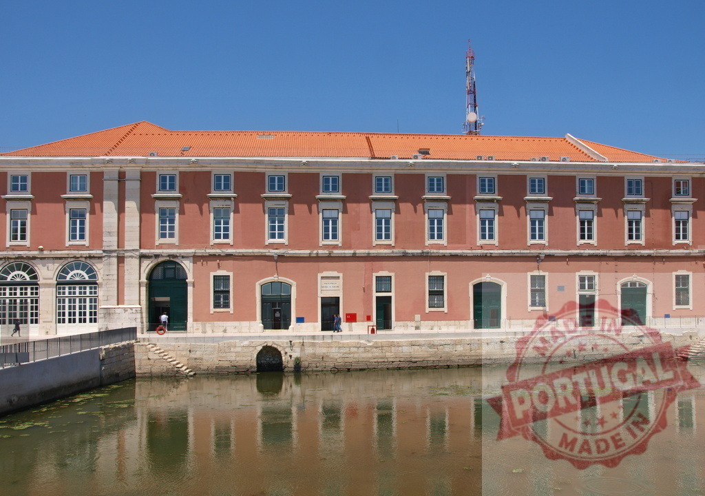 Portuguese Navy Museum building reflecting in Tagus River. Lisbon - Portugal | Navy Museum building along the waterfront, showcasing maritime history in Lisbon - Realized with Pictrs.com