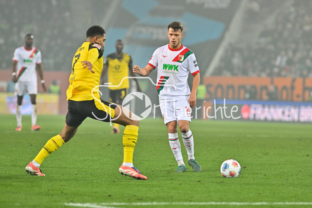 FC Augsburg - Borussia Dortmund | AUGSBURG, GERMANY - Jobe BELLINGHAM (Borussia Dortmund 7) against Robin FELLHAUER (FC Augsburg 19) during the bundesliga match between FC Augsburg vs. Borussia Dortmund on matchday 9 at WWK Arena on October 31, 2025 in Augsburg, Germany / DFL REGULATIONS PROHIBIT ANY USE OF PHOTOGRAPHS AS IMAGE SEQUENCES AND/OR QUASI-VIDEO