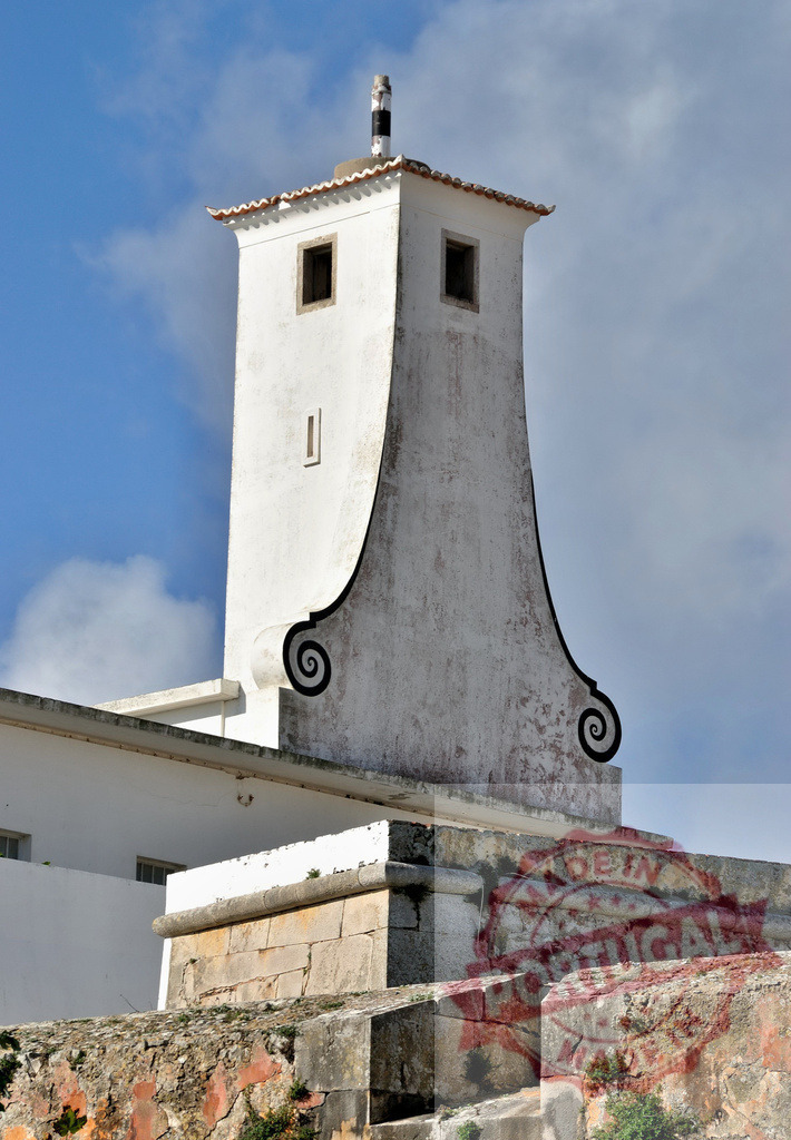 Peniche Fortress historical tower architecture against blue sky. Centro - Portugal | Peniche Fortress showcasing architectural detail of a historical tower under a clear blue sky - Realized with Pictrs.com