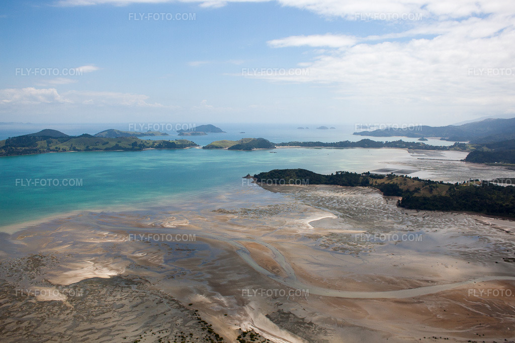 Aerial view: Water surface at the seaside coast of McGregor Bay in the district Coromandel in Wyuna Bay in Coromandel in the state Waikato, New Zealand.Photo: IMG_55589.jpg taken on 01/12/2013 by Werner Riehm/FLY-FOTO.comResolution of the original: 4657 x 3105 px