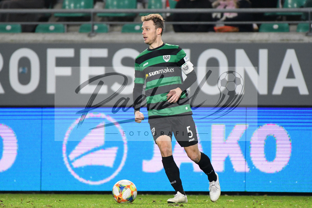 20200214_SCPFWK_0070 | Fussball, Herren: Julian Schauerte (SC Preussen Muenster) in Aktion, am Ball, Einzelaktion waehrend des Spiels der 3. Liga zwischen SC Preussen Muenster und FC Wuerzburger Kickers im Preussenstadion am 14.02.2020 in Muenster, Deutschland.DFB / DFL REGULATIONS PROHIBIT ANY USE OF PHOTOGRAPHS AS IMAGE SEQUENCES AND/OR QUASI-VIDEO. - Realisiert mit Pictrs.com