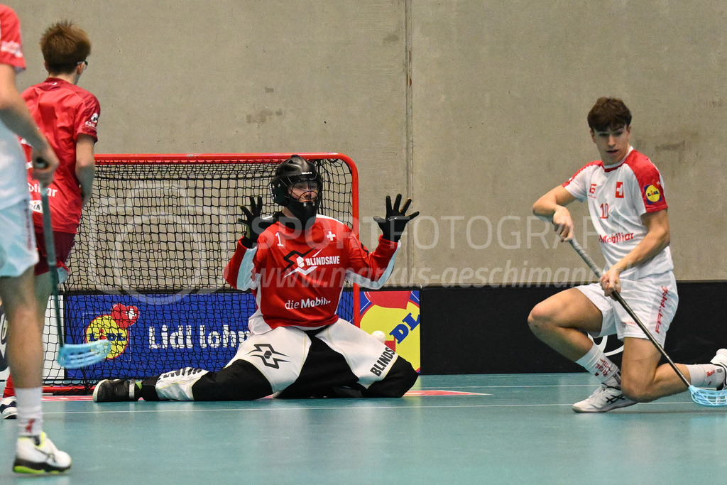 Switzerland B U19 vs Switzerland U19 - 4. February 2024 | Switzerland B U19 vs Switzerland U19
U19 Men International Matches in Switzerland
GoEasy Arena, Siggenthal Station
Switzerland forward #16 Dario Bürgler scores against Switzerland goalie #1 Eric Kunz.
Credit: Markus Aeschimann | <a href="https://www.markus-aeschimann.ch">Sportfotografie Markus Aeschimann</a> | <a href="https://www.instagram.com/sportfotografie.aeschimann">@sportfotografie.aeschimann</a> - Realisiert mit Pictrs.com