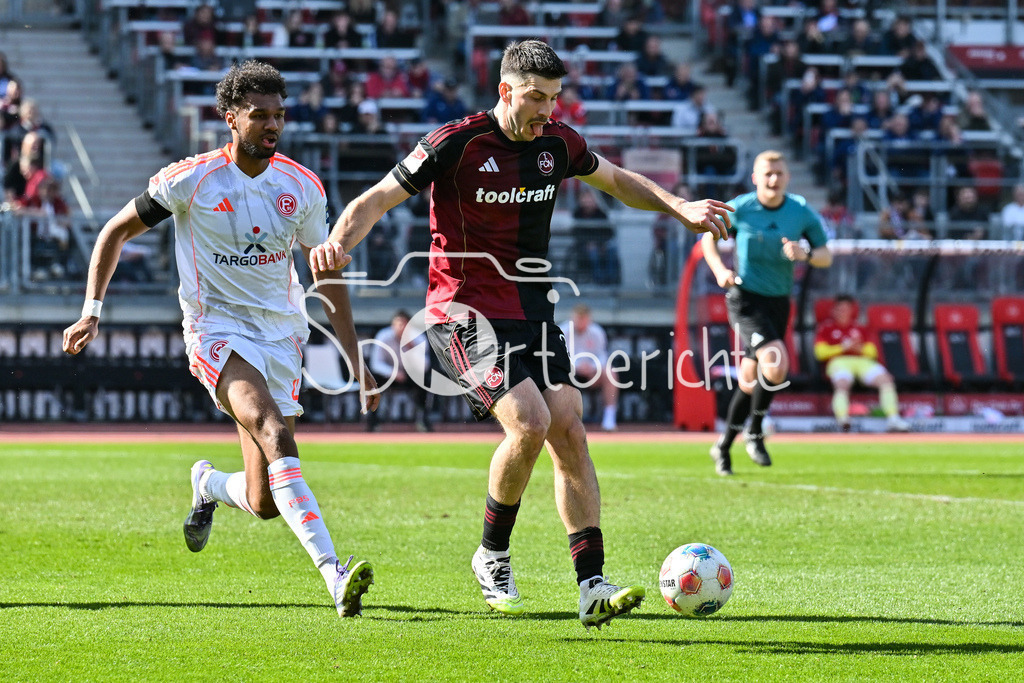 1. FC Nürnberg - Fortuna Düsseldorf | NUREMBERG, GERMANY - 07. MARCH:  im Duell Elias EGOULI (Fortuna Düsseldorf 44) und Luka LOCHOSHVILI (1. FC Nuernberg 24) während dem Match zwischen dem 1. FC Nürnberg und Fortuna Düsseldorf am 25. Spieltag der 2. Bundesliga im Max Morlock Stadion / DFL REGULATIONS PROHIBIT ANY USE OF PHOTOGRAPHS AS IMAGE SEQUENCES AND/OR QUASI-VIDEO