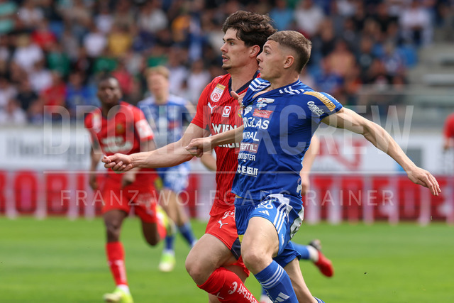 TSV Egger Glas Hartberg vs SK Rapid Wien – Championship Group    | Hartberg, Austria, 19.Apr.26 - SOCCER - ADMIRAL Bundesliga, TSV Egger Glas Hartberg vs SK Rapid Wien. The image shows Jakob Schoeller (SK Rapid Wien) and Elias Havel (Hartberg). 