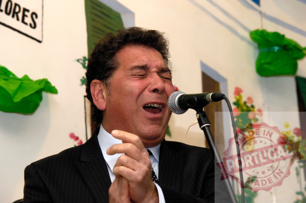 Male Flamenco singer performing emotionally with microphone | Male vocalist performing passionate Flamenco music, eyes closed, expressing deep emotion - Realized with Pictrs.com