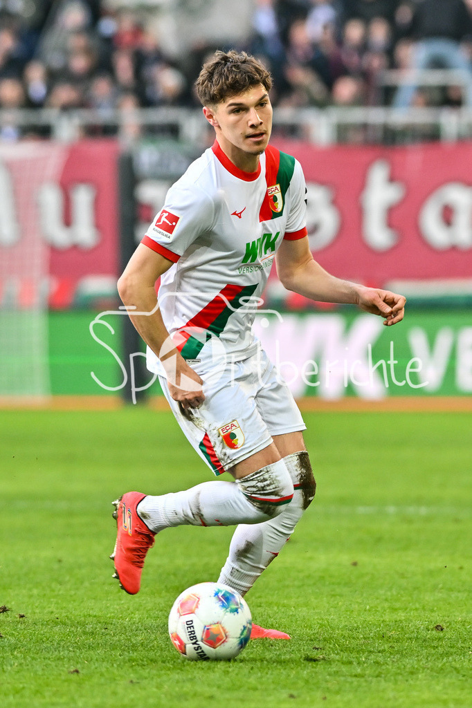 FC Augsburg - 1. FC Heidenheim | AUGSBURG, GERMANY - 15. FEBRUARY: am Ball Mert KOEMUER (KÖMÜR, KOMUR, FC Augsburg 36) / Einzelfoto / Freisteller während dem Bundesligamatch zwischen dem FC Augsburg und dem 1. FC Heidenheim am 22. Spieltag in der WWK-Arena / DFL REGULATIONS PROHIBIT ANY USE OF PHOTOGRAPHS AS IMAGE SEQUENCES AND/OR QUASI-VIDEO