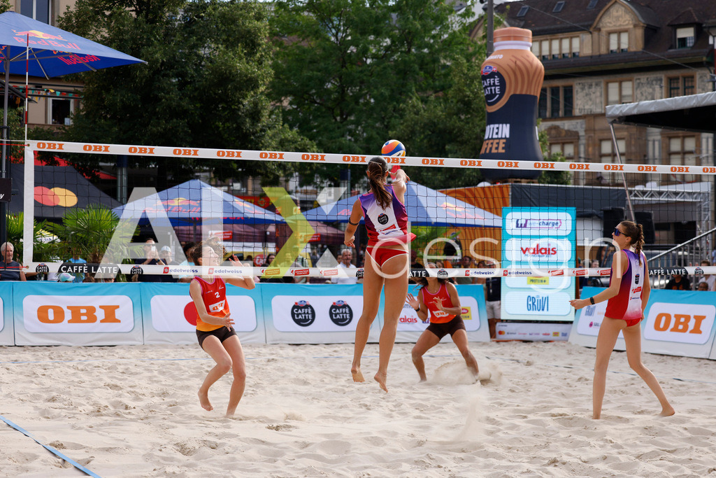 Obi BeachTour 2026 - Basel | BASEL, SWITZERLAND - JULY 18: ZOÉ FLÜCKIGER (SUI) attack / spike during the Obi BeachTour 2026 match between ZOBRIST / LUTZ (SUI) and FLÜCKIGER / DEMIERRE (SUI) at Barfüsserplatz on July 18, 2026 in Basel, Switzerland. - Realisiert mit Pictrs.com