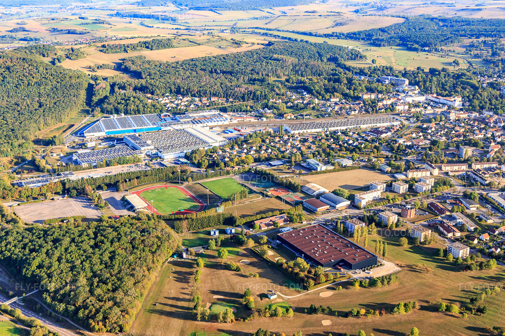 Aerial view: Nestlé Waters Supply Est beyond the Stade Municipal Jean Bouloumié and Complexe Multisports Pierre de Coubertin in Vittel in the state Vosges, France. – Photo: IMG_118450.jpg taken on 09/16/2019 by Werner Riehm/FLY-FOTO.com – Resolution of the original: 5472 x 3648 px – WWW.NESTLE-WATERS.FR – CENTRE DE PREPARATION OMNISPORTS VITTEL
