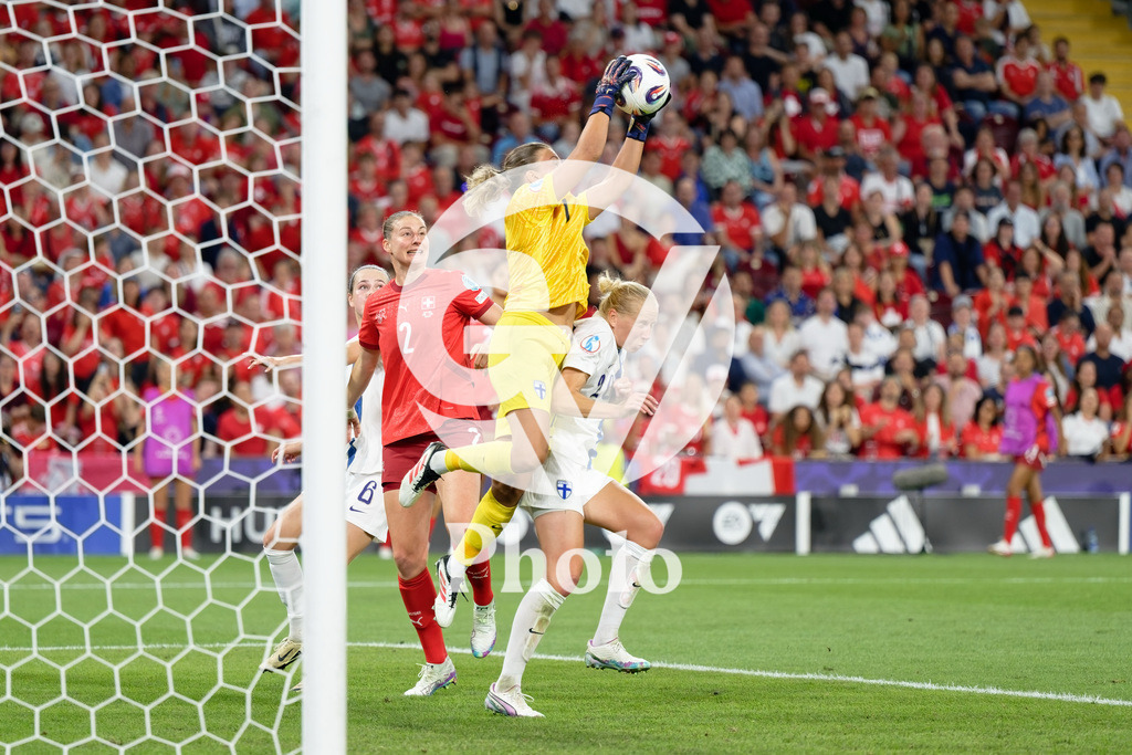 Finland v Switzerland: UEFA Women's EURO 2025 Group A | GENEVA, SWITZERLAND - JULY 10: Anna Koivunen of Finland (C) makes a save Julia Stierli of Switzerland (L) Eveliina Summanen of Finland (R) during the UEFA Women's EURO 2025 Group A match between Finland and Switzerland at Stade de Geneve on July 10, 2025 in Geneva, Switzerland. (Photo by Giuseppe Velletri/Sports Press Photo/Getty Images)