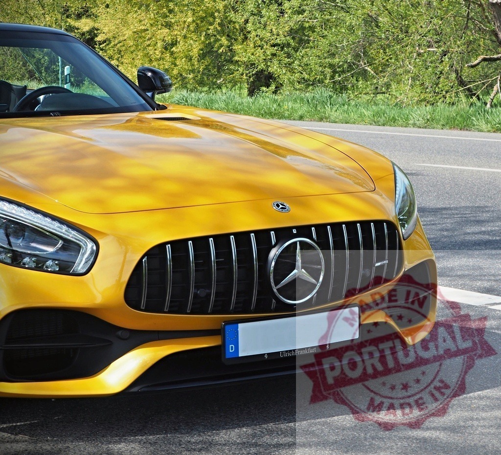 Yellow Mercedes-Benz AMG GT sports car on road | Yellow Mercedes-Benz AMG GT sports car front on a sunny road - Realized with Pictrs.com
