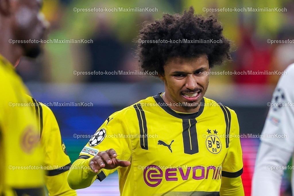 UCL04032502178 | 04.03.2025, Fußball, UEFA Champions League, Borussia Dortmund - OSC Lille, Signal Iduna Park, Runde der 16, Saison 2024 2025: Karim Adeyemi (BVB #27) schneidet eine Grimasse Mimik Gestik