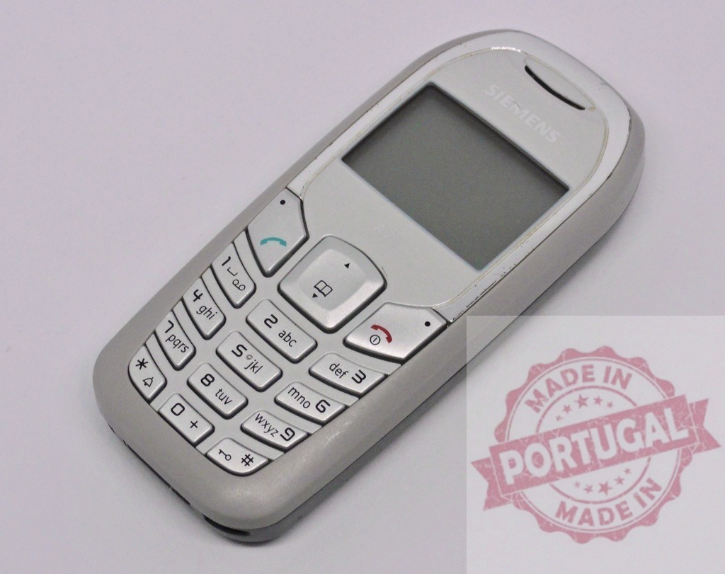 Old Siemens mobile phone showing its keypad and display | Classic Siemens mobile phone resting on a white background, showcasing its keypad and blank display - Realized with Pictrs.com