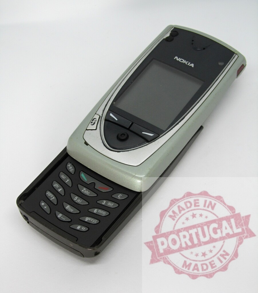 Nokia 8910i classic mobile phone showing keypad | Classic Nokia 8910i mobile phone with sliding cover revealing keypad, isolated on white background - Realized with Pictrs.com