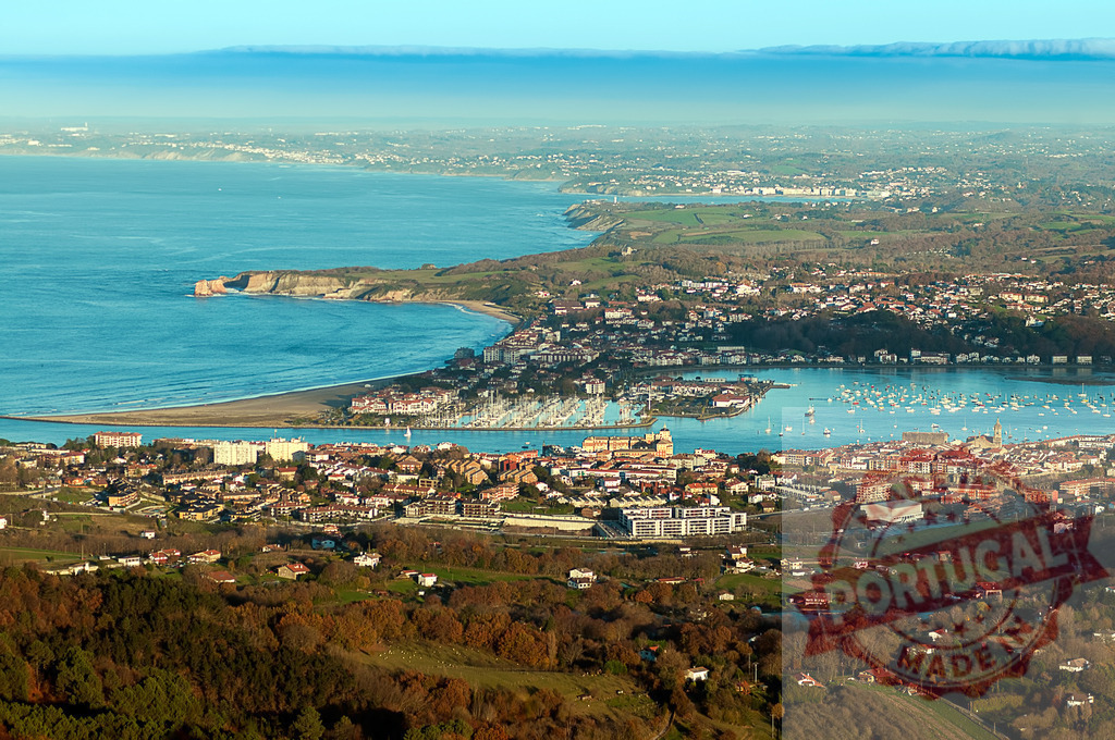 Hendaye cityscape overlooking Txingudi Bay in the Basque Country, France | Aerial view of Hendaye cityscape overlooking Txingudi Bay in the Basque Country, France, featuring boats, harbor, and coastline - Realisiert mit Pictrs.com