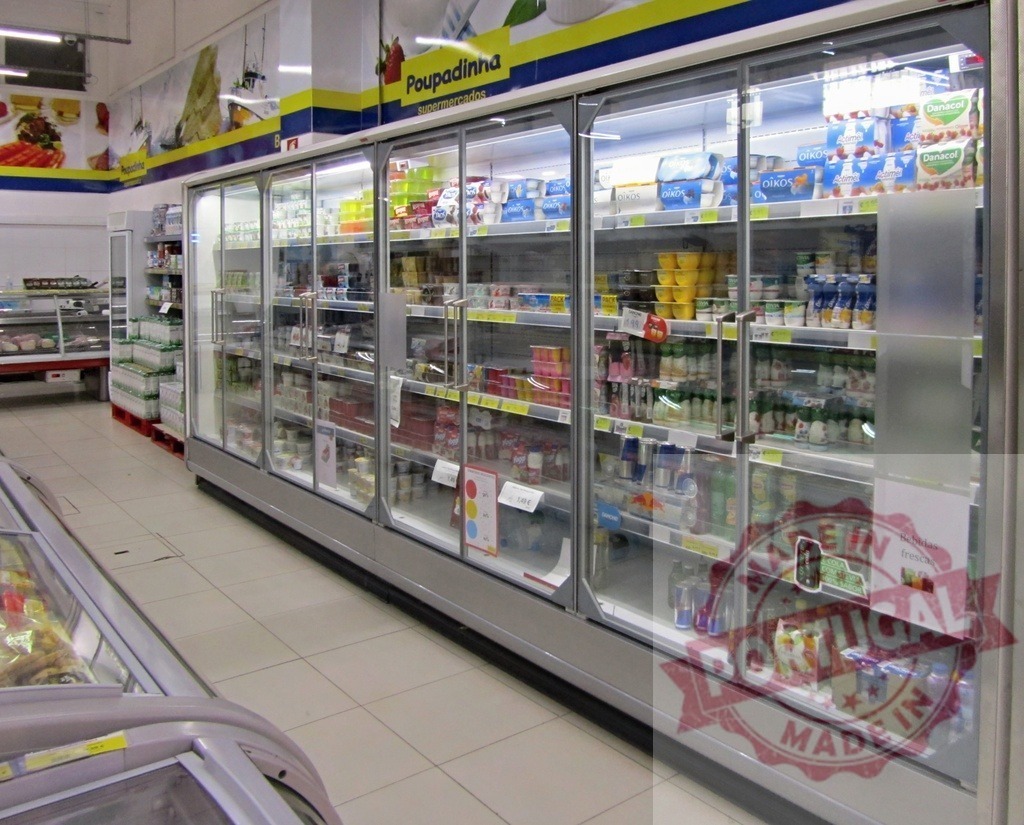Supermarket refrigerated display cases with dairy products and beverages | Supermarket interior showing refrigerated display cases stocked with various dairy products and cold drinks - Realized with Pictrs.com