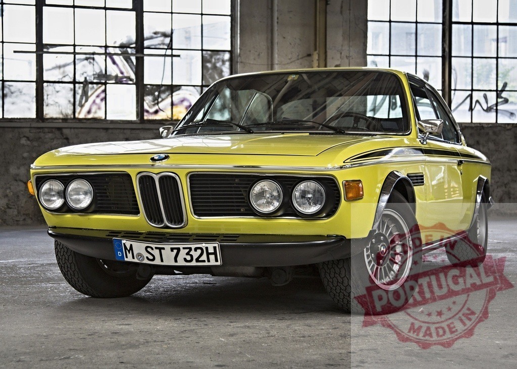 Classic BMW 3.0 CSL posing in an abandoned factory | Yellow BMW 3.0 CSL parked inside a decaying industrial building with large windows - Realisiert mit Pictrs.com
