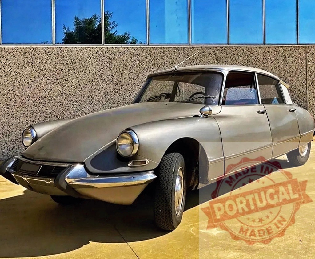 Citroën DS vintage french luxury car details | Silver Citroën DS vintage luxury car parked against a modern building - Realized with Pictrs.com