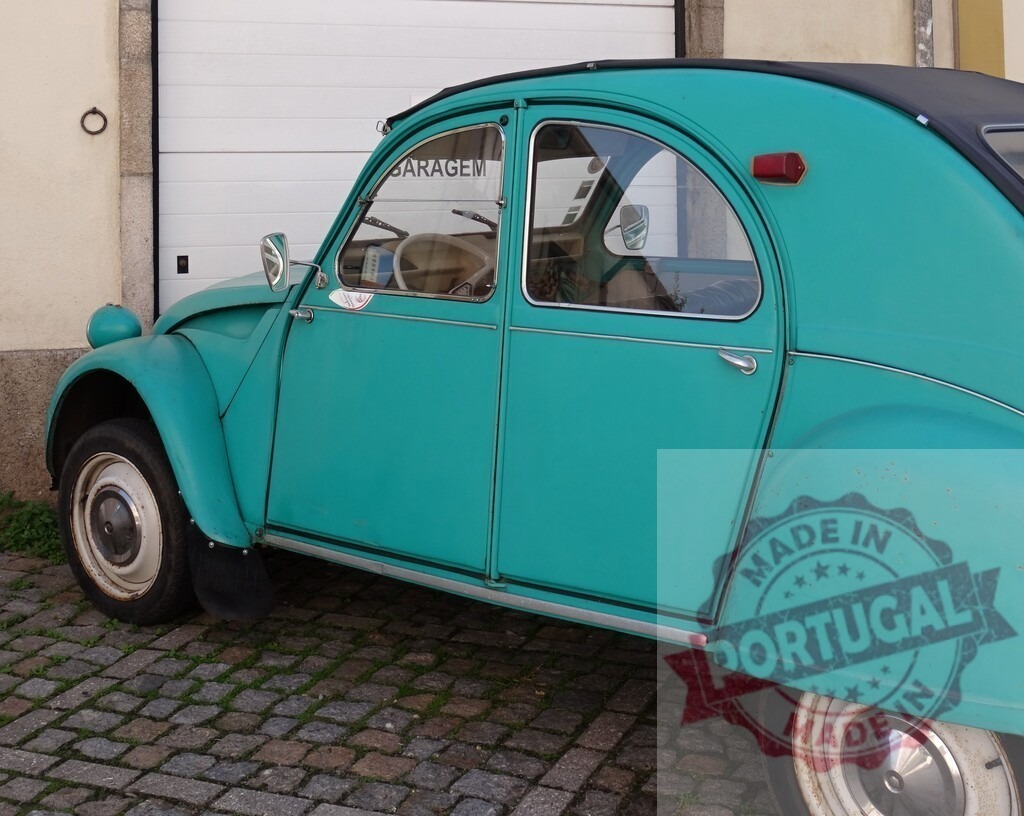 Citroën 2CV vintage car parked on cobblestones | Teal Citroën 2CV classic automobile parked outdoors on a cobbled street - Realized with Pictrs.com