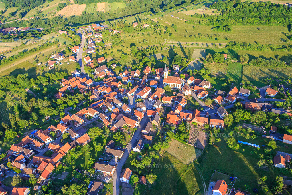 Aerial view: Church in the village center from the west in Wingen in the state Bas-Rhin, France.Photo: IMG_080311.jpg taken on 06/05/2015 by Werner Riehm/FLY-FOTO.comResolution of the original: 5472 x 3648 px