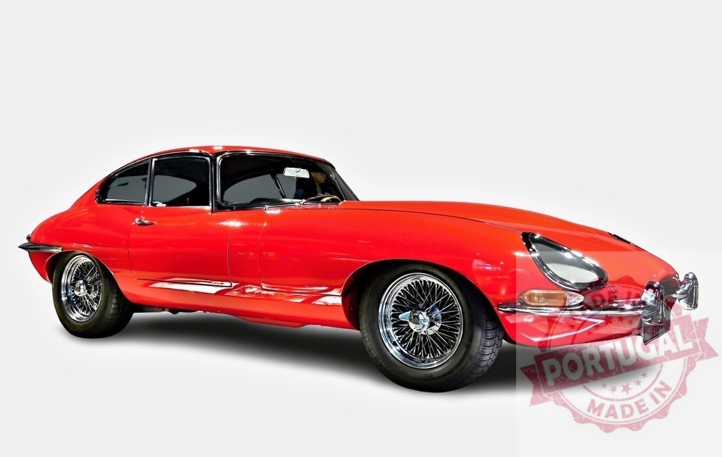 Red Jaguar E-Type shining on white background | Classic red Jaguar E-Type standing out on a white background, showcasing its timeless design and beauty - Realized with Pictrs.com