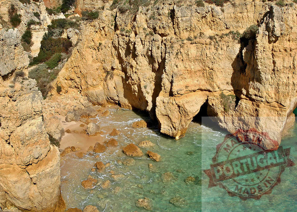 Ponta da Piedade Algarve coast cliff and turquoise sea | Coastal cliffs defining a small sandy cove with clear turquoise water and rock formations - Realized with Pictrs.com