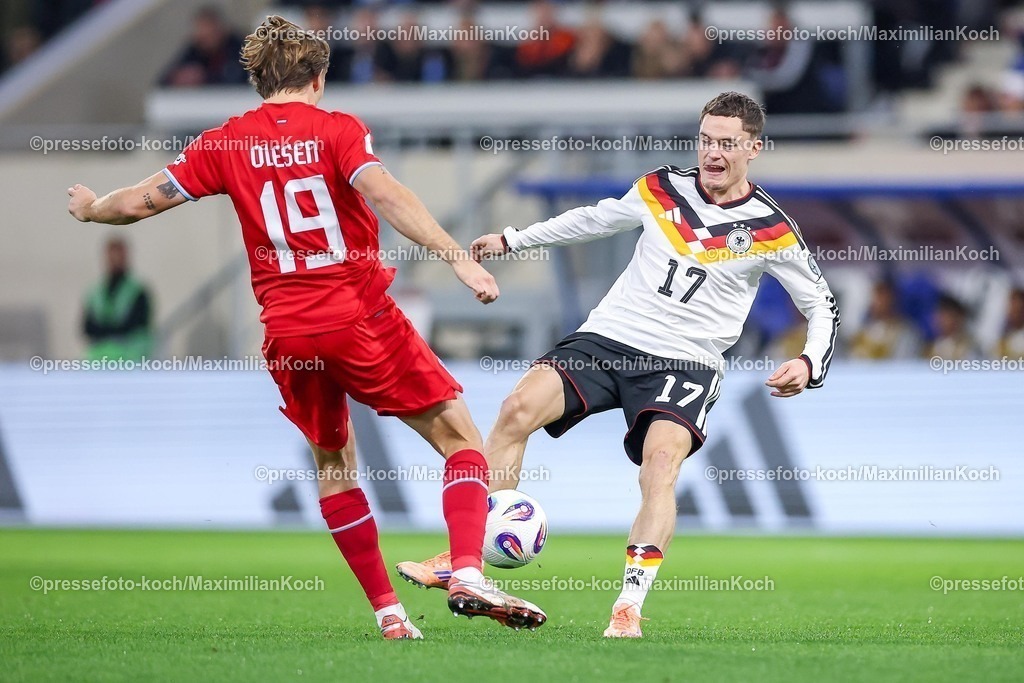 DFB14112501052 | 14.11.2025, Fußball, Länderspiel, WM-Qualifikation Europa, Deutschland - Luxemburg, Stade de Luxembourg (Croix de Gasperich, Luxemburg), 9. Spieltag, Saison 2025 2026: Mathias Olesen (LUX #19) im Zweikampf gegen  Florian Wirtz (GER #17)  Regulations prohibit any use of photographs as image sequences and or quasi-video.