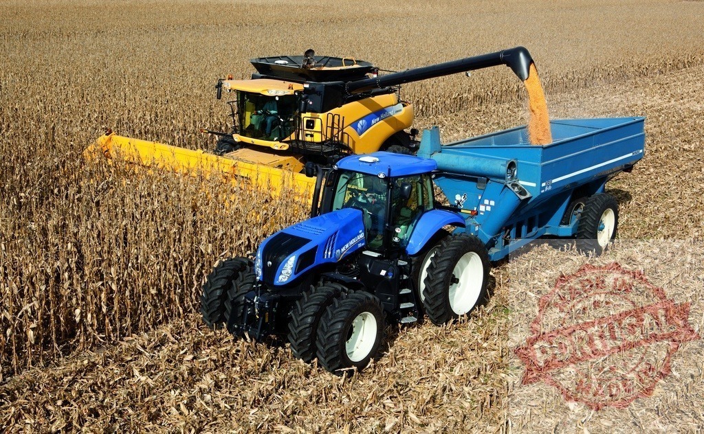 New Holland combine harvester collecting corn grains in field | Combine harvester and tractor working together during corn harvest on a farm field - Realized with Pictrs.com