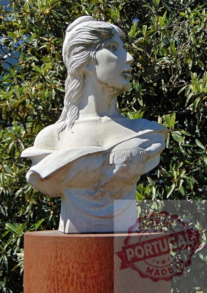 Marianne bust representing French republic in garden. Region Norte - Portugal | Marianne bust sculpture symbolizing France and freedom in an outdoor setting - Realized with Pictrs.com