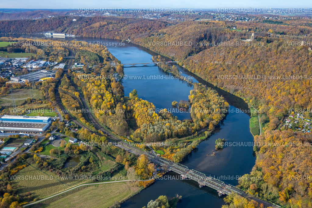 Hagen251100271 | Luftbild, Ortsteil mit Gewerbegebiet Bathey, Eisenbahnbrücke über den Fluss Ruhr, Hengsteysee und Brücke Dortmunder Straße, Ardeywald und RWE Kopechenwerk, rechts BUrg Hohensyburg Denmal mit Aussichtsplattform Kaiser-Wilhelm-Denkmal, herbstliche Bäume, Boele, Hagen, Ruhrgebiet, Nordrhein-Westfalen, Deutschland